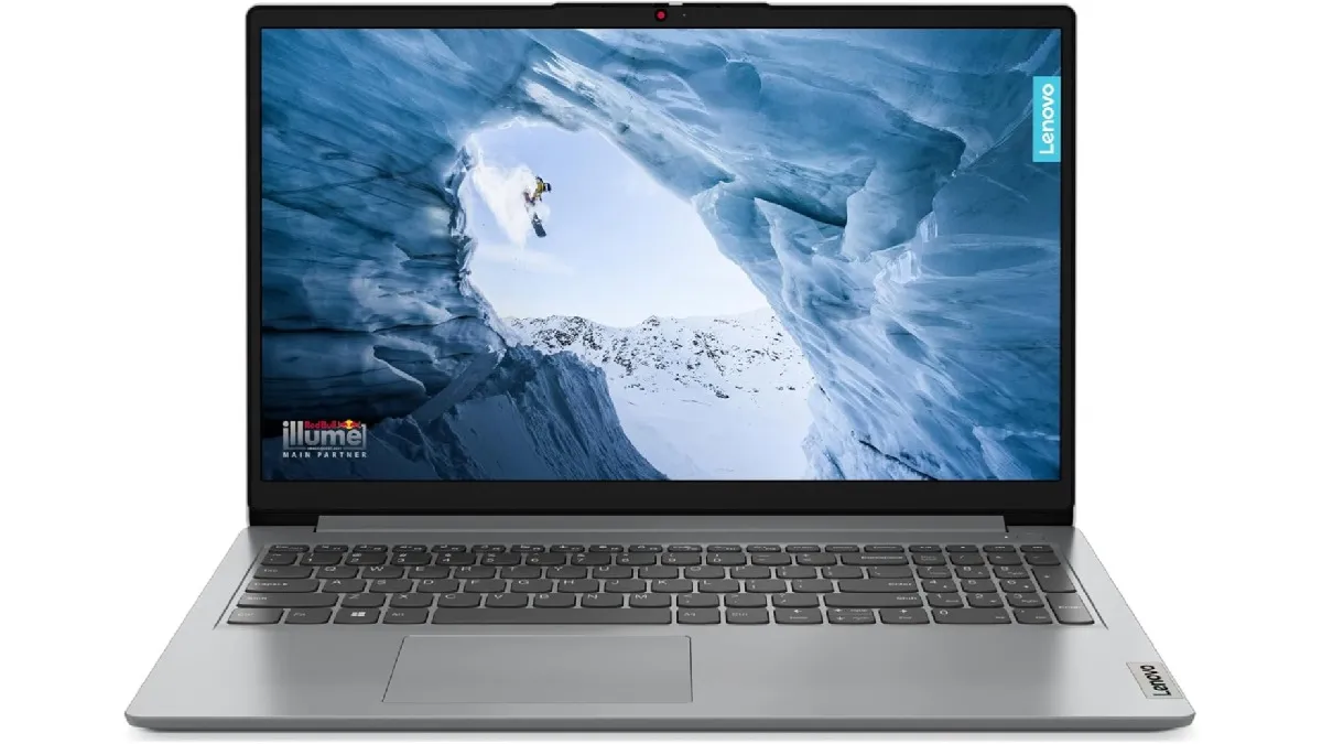 Notebook Lenovo IdeaPad 1 cinza aberto em perspectiva lateral; na tela, imagem abstrata azul e texto flutuante destacando o processador Intel Core i3.